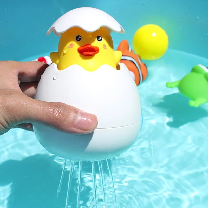 Cute duck and penguin bath toys with water spraying action for kids aged 0-6.