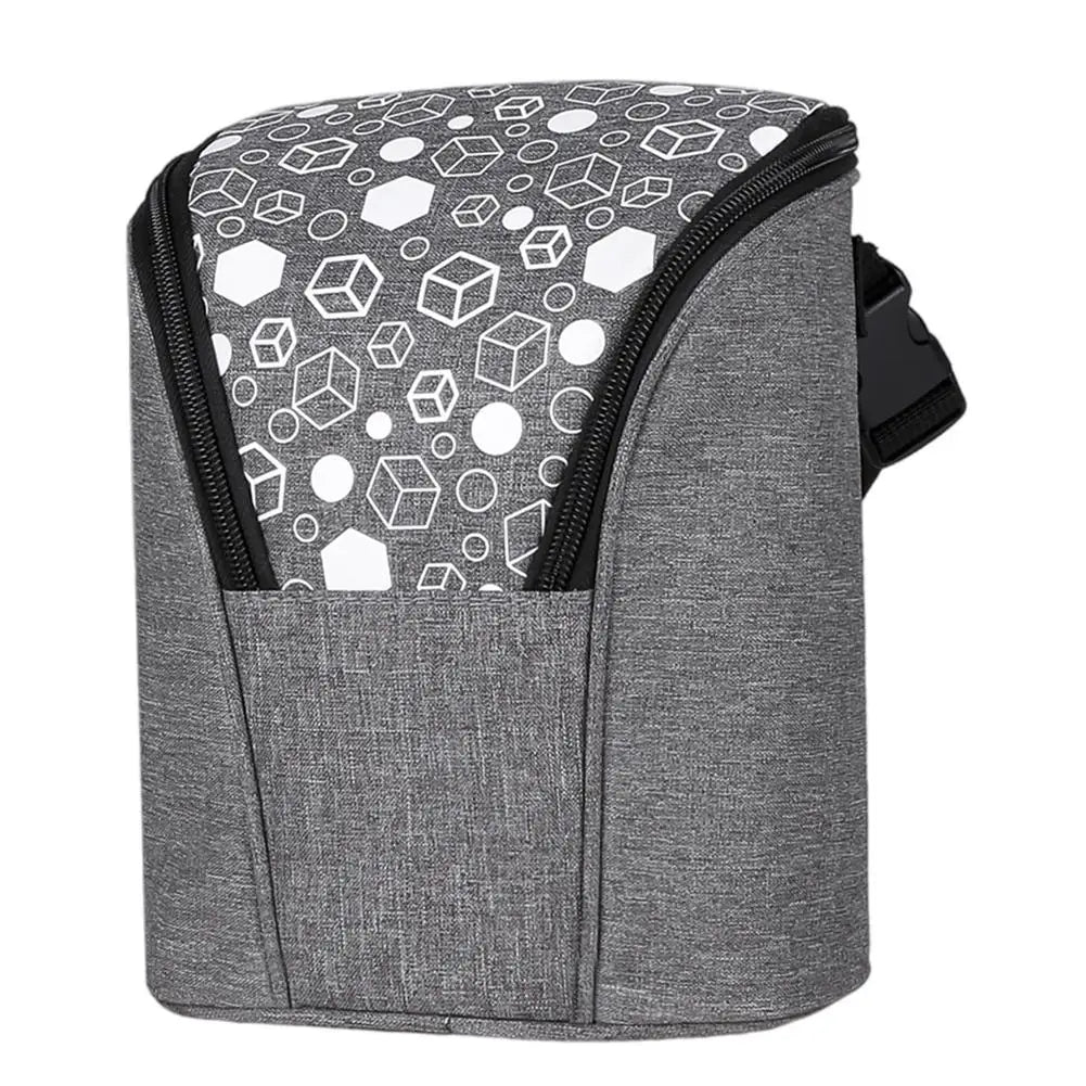 Breast milk cooler bag with insulated lining, ice pack, and adjustable strap.