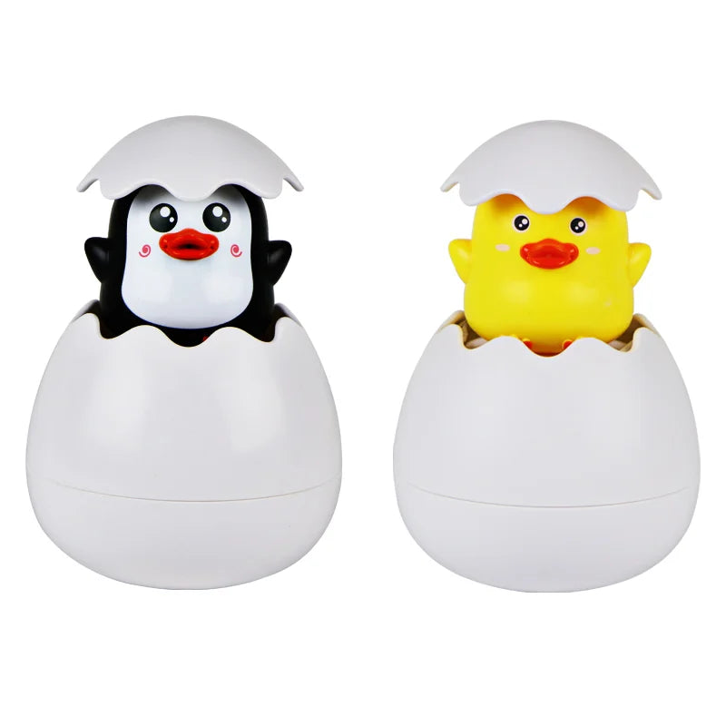 Cute duck and penguin bath toys with water spraying action for kids aged 0-6.