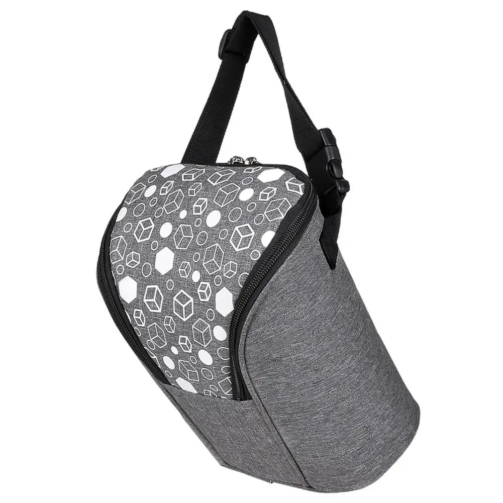 Breast milk cooler bag with insulated lining, ice pack, and adjustable strap.