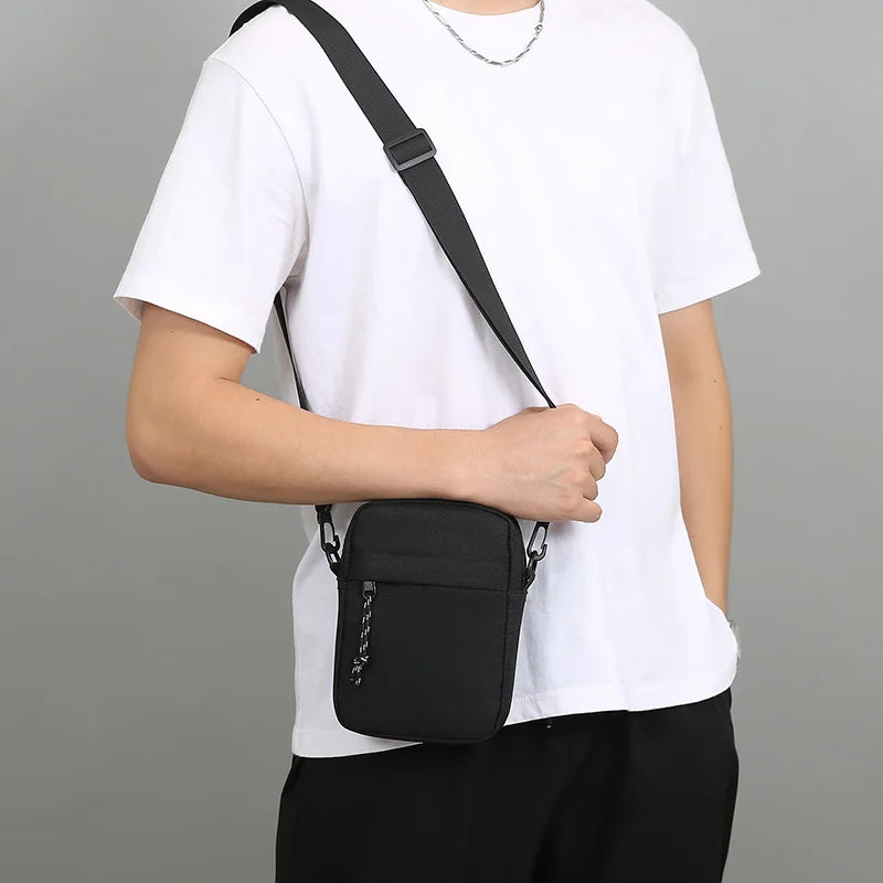 Men's mini crossbody bag made from durable nylon with an adjustable strap.