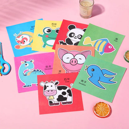 Colorful paper cut-outs and scissors from a DIY craft kit for children, featuring various cartoon-themed designs.