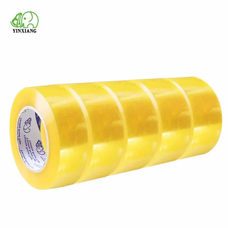 Five rolls of clear packaging tape stacked, showcasing their length and thickness, perfect for secure sealing and shipping.