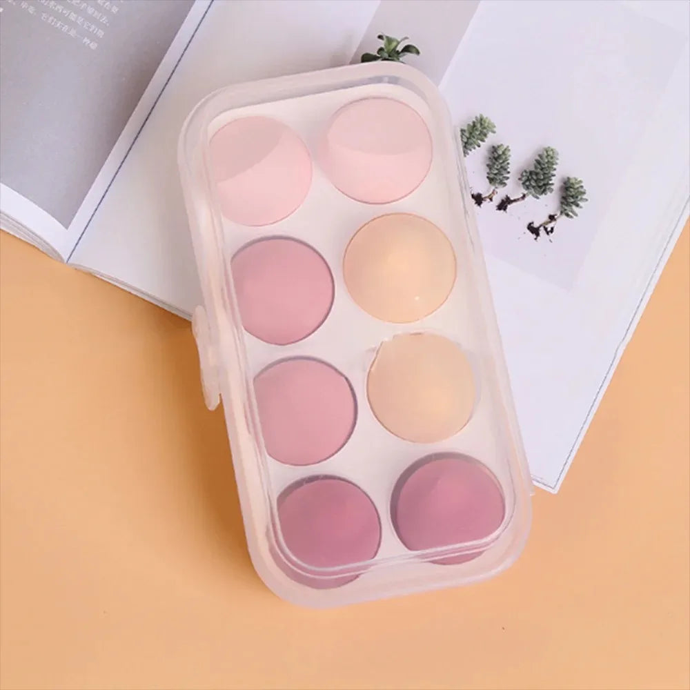 Assorted makeup sponges and puffs in a set of 4/8, ideal for applying foundation, concealer, and blush. Made of soft latex, perfect for a smooth, flawless makeup finish.