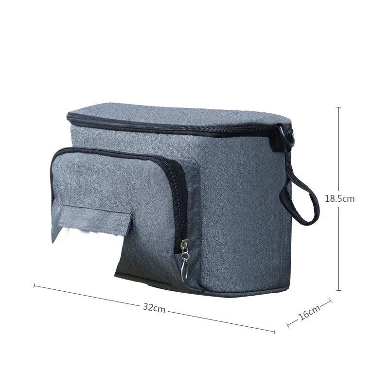 Waterproof denim diaper bag with large capacity, adjustable straps, and insulated drink holders, attached to a stroller.