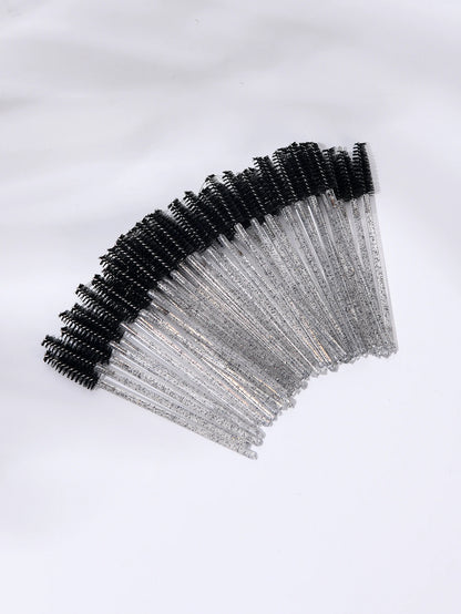 A set of 50 disposable eyelash brushes with soft bristles, perfect for mascara application and lash grooming. Ideal for lash extensions and personal or professional makeup use.