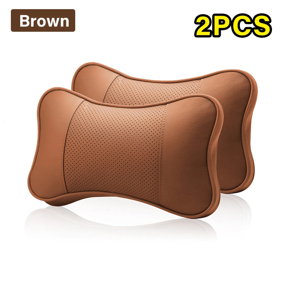 Two cowhide car neck pillows with an ergonomic design for universal use, providing support and comfort for neck and head while driving.