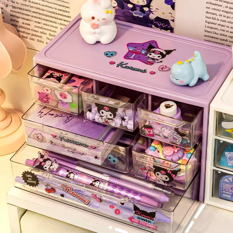 Sanrio 6-Grid Transparent Storage Box with Kuromi, Melody, and Cinnamoroll stickers, ideal for organizing pens and stationery on a desk.