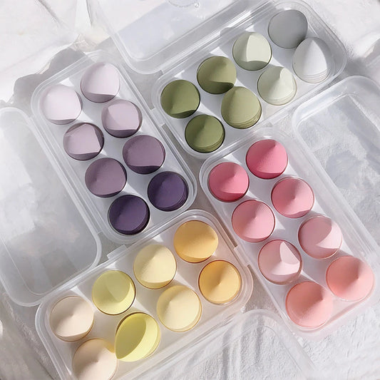 Assorted makeup sponges and puffs in a set of 4/8, ideal for applying foundation, concealer, and blush. Made of soft latex, perfect for a smooth, flawless makeup finish.