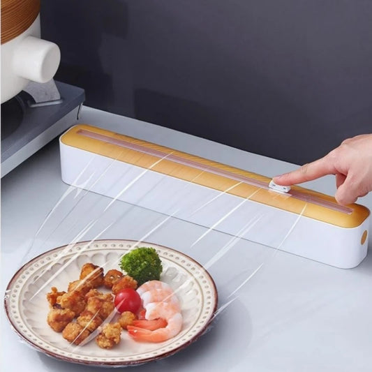 Plastic cling wrap dispenser with cutter, anti-drop design, fits up to 35 cm wide wraps.