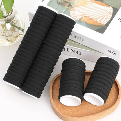 A set of 50/100 black hair bands made of high elastic polyester, perfect for women and girls.