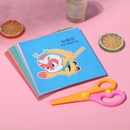 Colorful paper cut-outs and scissors from a DIY craft kit for children, featuring various cartoon-themed designs.