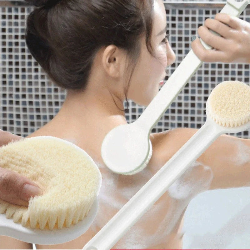 Long handle bath brush with soft bristles for exfoliating and massaging the skin during showers.