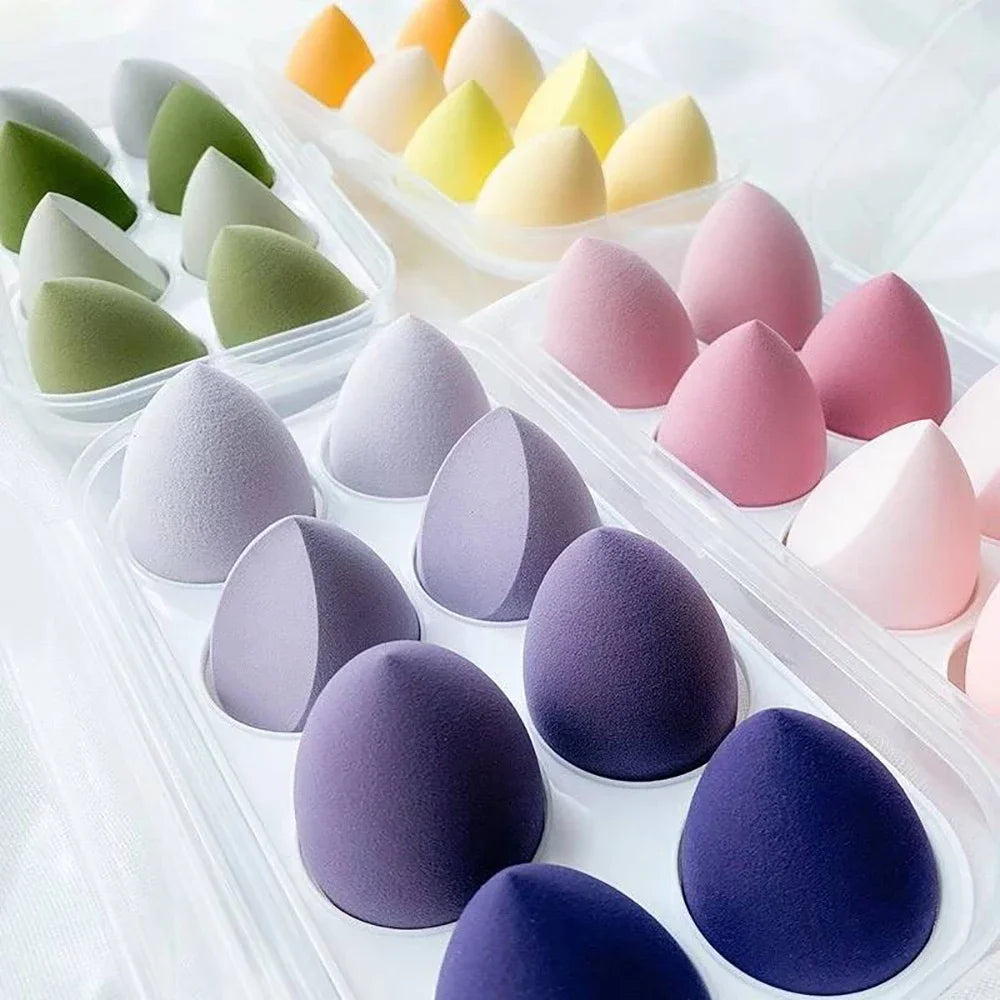 Assorted makeup sponges and puffs in a set of 4/8, ideal for applying foundation, concealer, and blush. Made of soft latex, perfect for a smooth, flawless makeup finish.