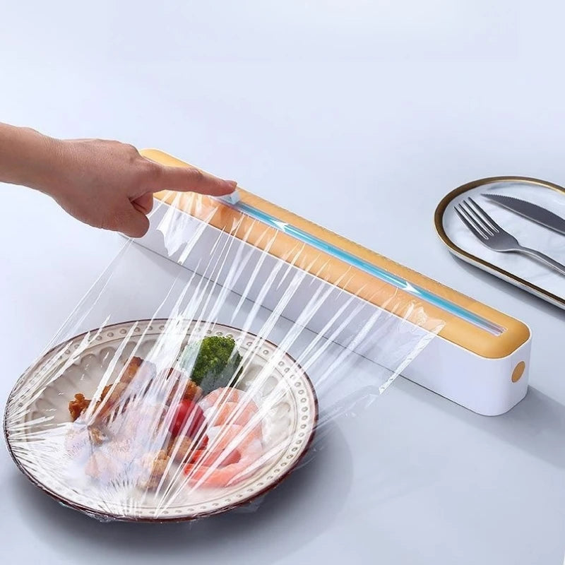 Plastic cling wrap dispenser with cutter, anti-drop design, fits up to 35 cm wide wraps.