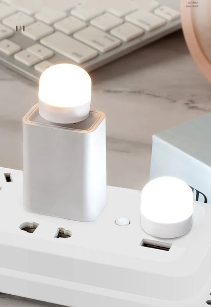 Mini USB Night Light in warm white LED, compact and energy-efficient. Ideal for reading and night lighting. Plugs into any USB port for instant illumination. Available individually or in packs of 50.