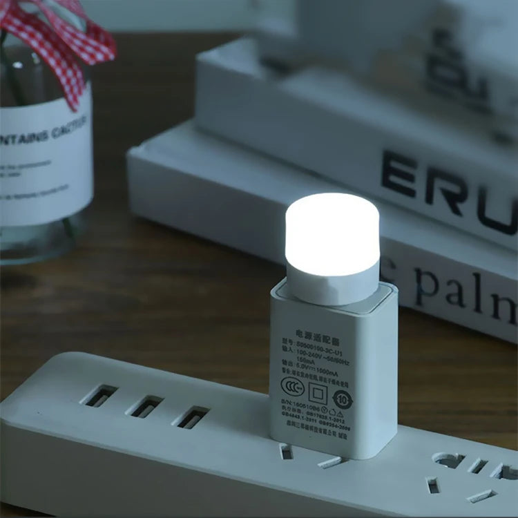 Mini USB Night Light in warm white LED, compact and energy-efficient. Ideal for reading and night lighting. Plugs into any USB port for instant illumination. Available individually or in packs of 50.