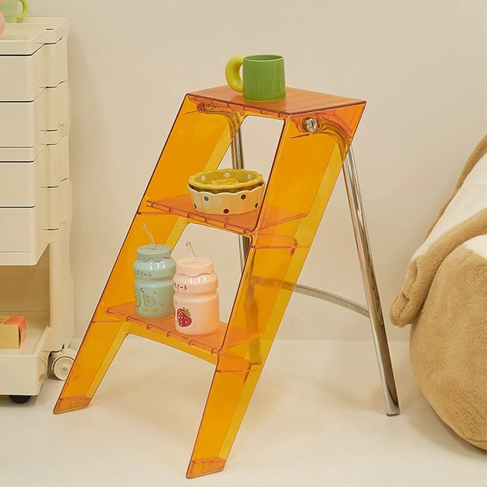 Acrylic transparent plastic 3-step folding stepladder for indoor use.