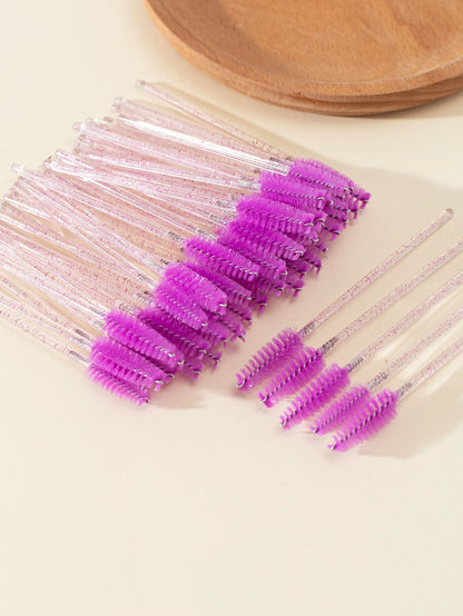 A set of 50 disposable eyelash brushes with soft bristles, perfect for mascara application and lash grooming. Ideal for lash extensions and personal or professional makeup use.