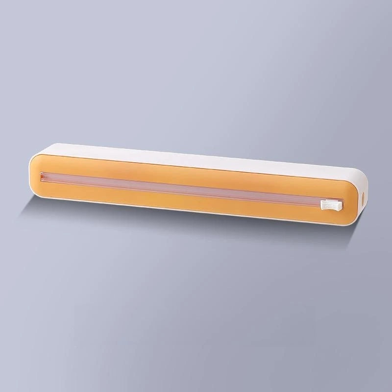 Plastic cling wrap dispenser with cutter, anti-drop design, fits up to 35 cm wide wraps.