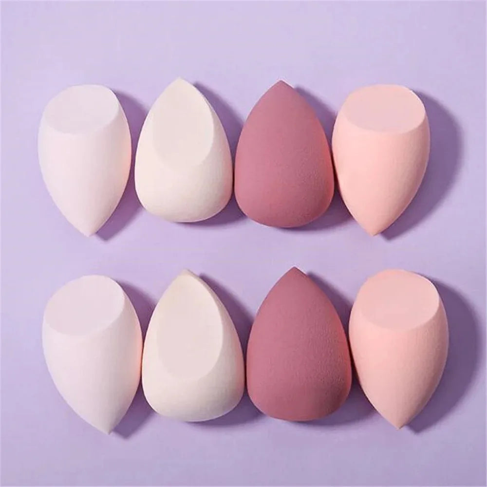 Assorted makeup sponges and puffs in a set of 4/8, ideal for applying foundation, concealer, and blush. Made of soft latex, perfect for a smooth, flawless makeup finish.